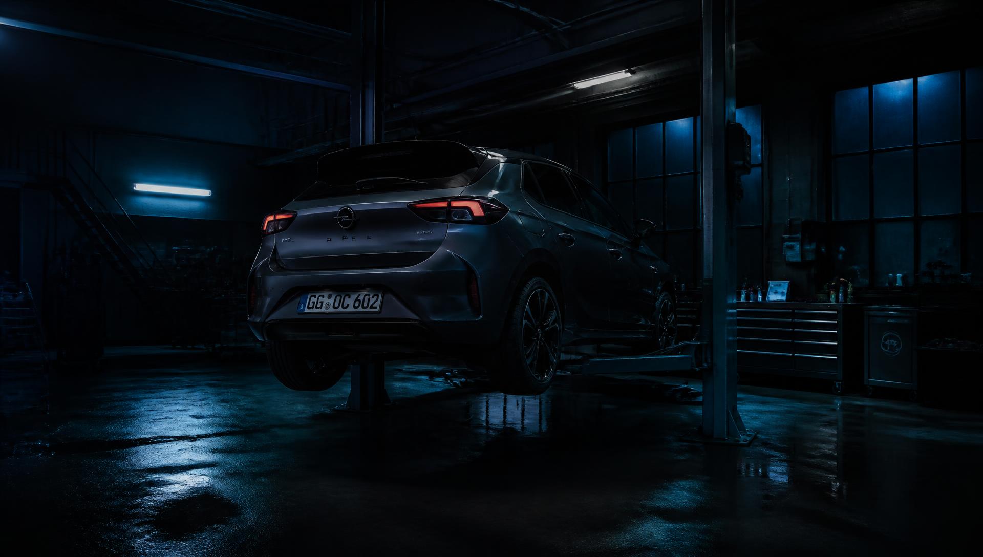 Opel vehicle on a lift in a modern workshop